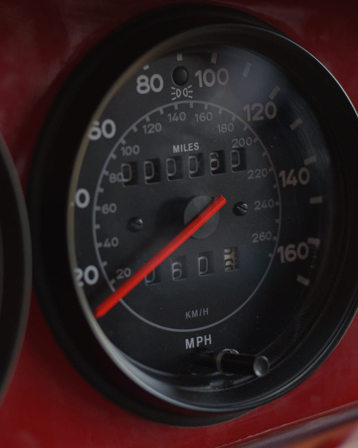 Cockpit gauges up close, tachometer needle and speedometer of the Safari car