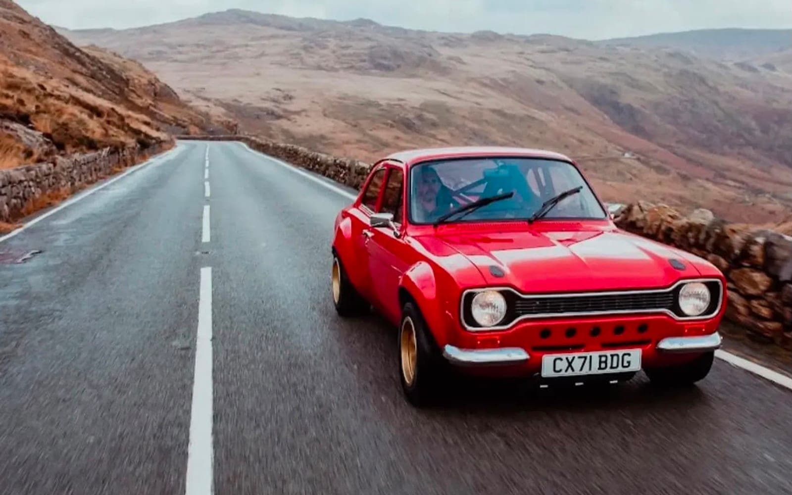 Red Ford Escort Mk1 rally build on a mountain road